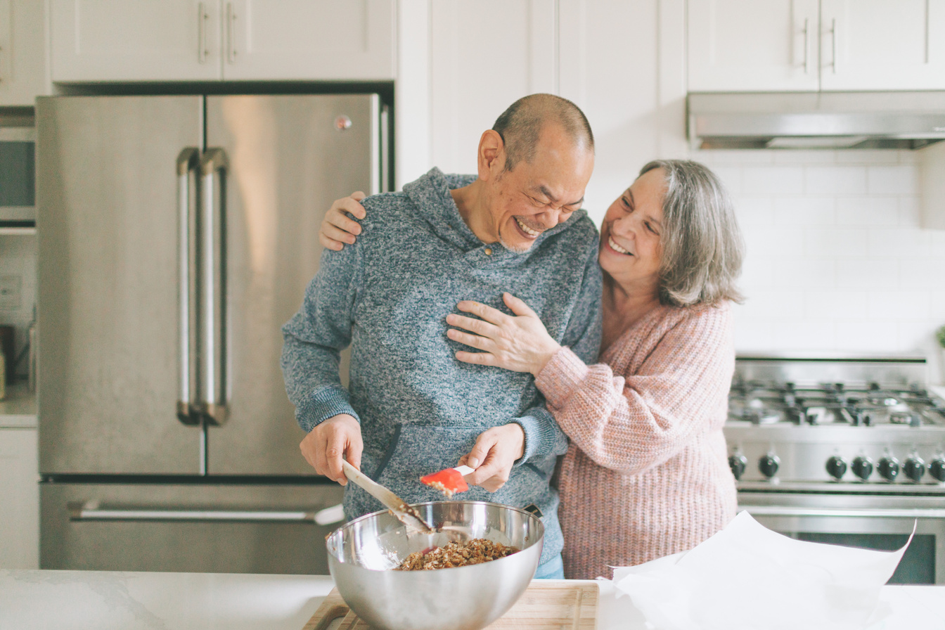 Elderly Couple Having Fun While Cooking in the Kitchen